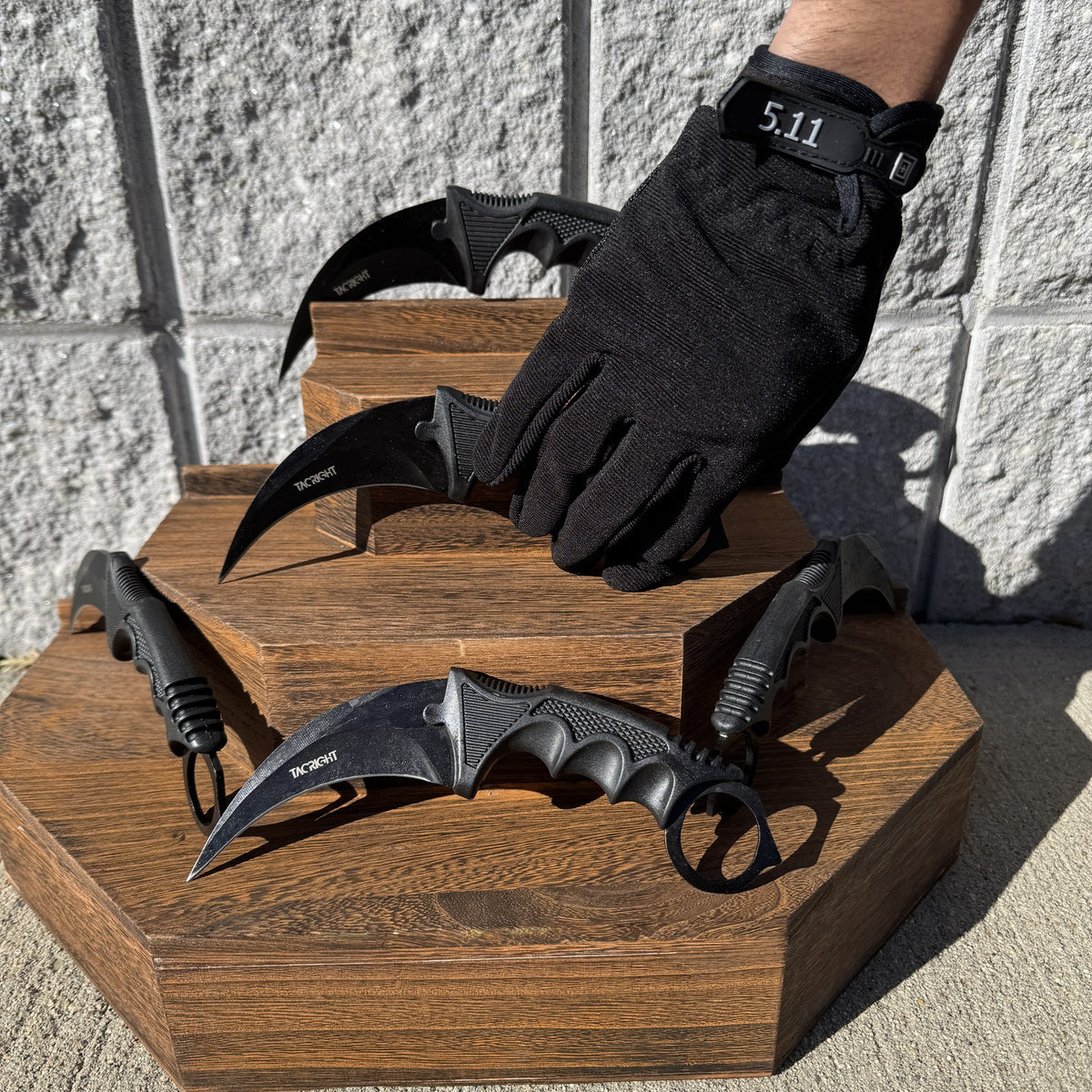 Karambit knife carried on a sleeve