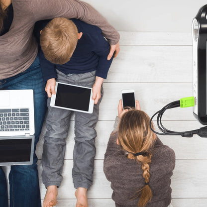 Portable solar power station charging tablets and phones indoors