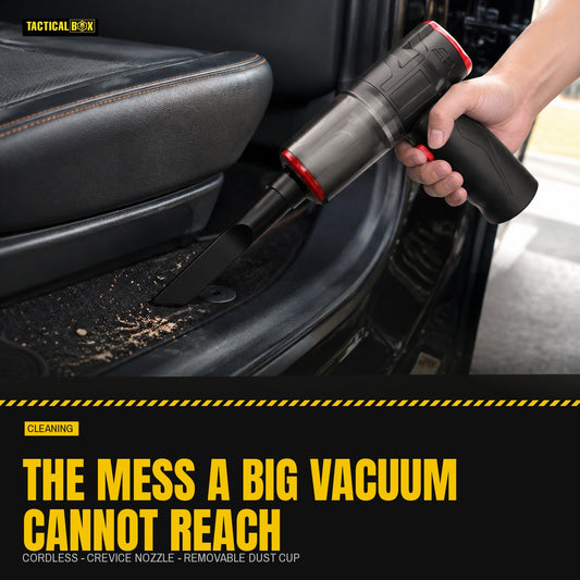 Mini Vacuum clearing crumbs from a car seat and footwell