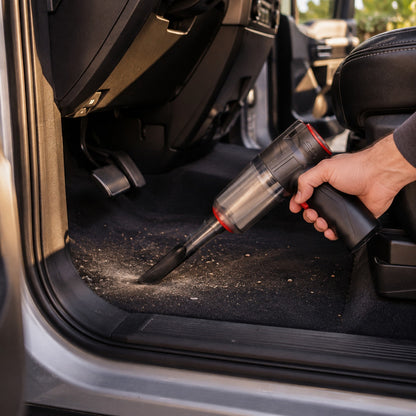 Mini Vacuum cleaning out the footwell of a truck