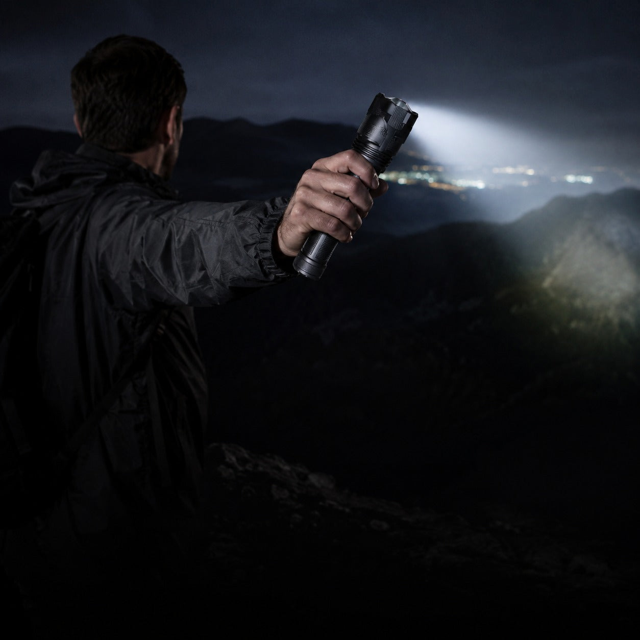 Novalite XPH-50 flashlight held out at night over open country