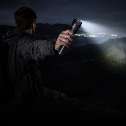 Novalite XPH-50 flashlight held out at night over open country