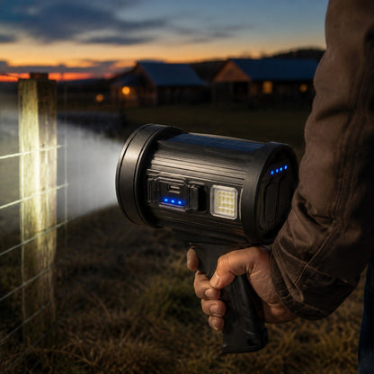 Outdoor Searchlight held low walking a fence line at dusk, beam on the wire