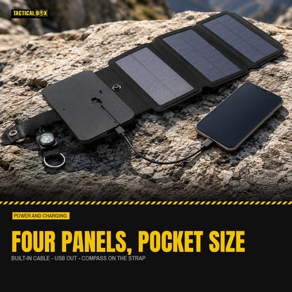 4 Panel Solar Charger unfolded on a boulder in mountain sun charging a phone