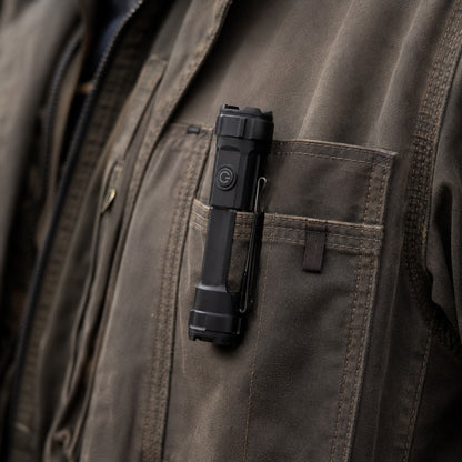 Tacright USB Flashlight clipped to a jacket pocket, seen close in daylight
