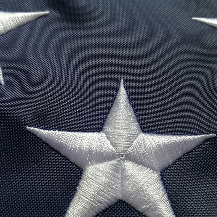 Close view of a single embroidered star stitched into the canton