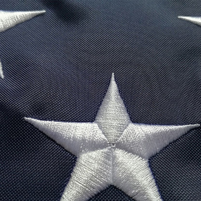 Close view of a single embroidered star stitched into the canton